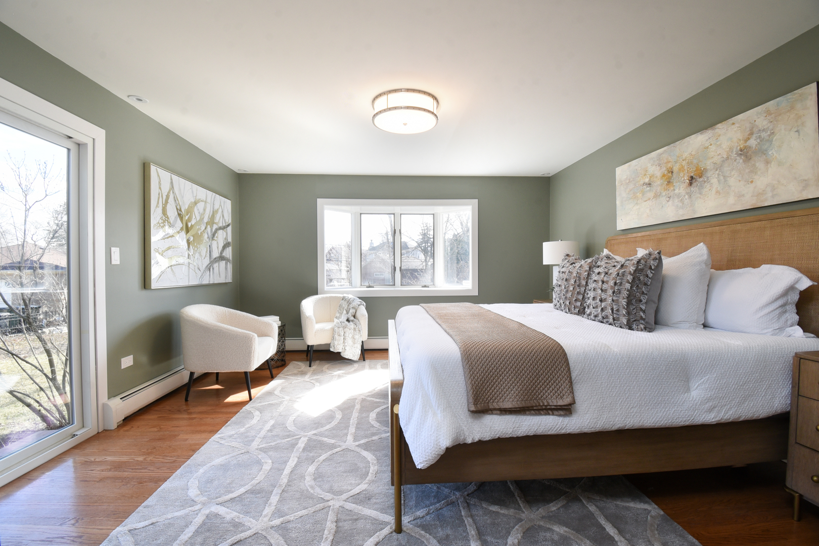 427 Uvedale Road Riverside, IL 60546 - Photo 15 of 33 a bedroom with a bed couch and large windows