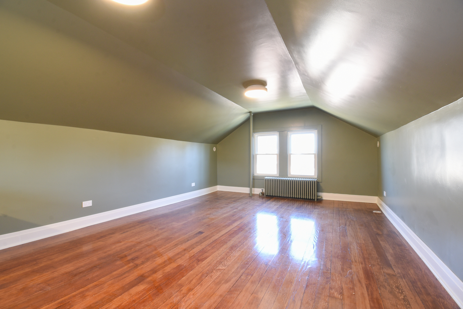 427 Uvedale Road Riverside, IL 60546 - Photo 23 of 33 an empty room with wooden floor and windows