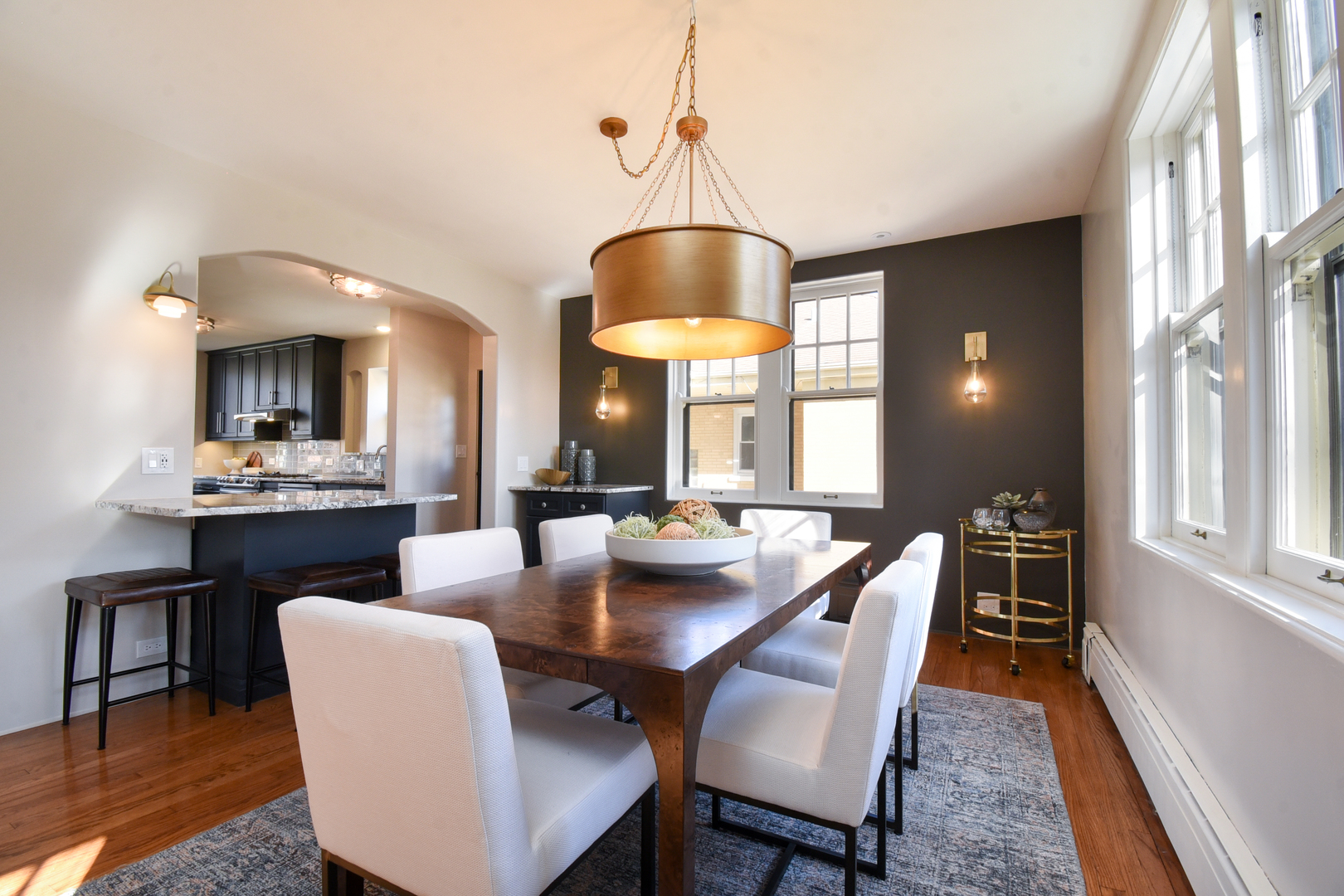 427 Uvedale Road Riverside, IL 60546 - Photo 6 of 33 a dining room with furniture a chandelier and window