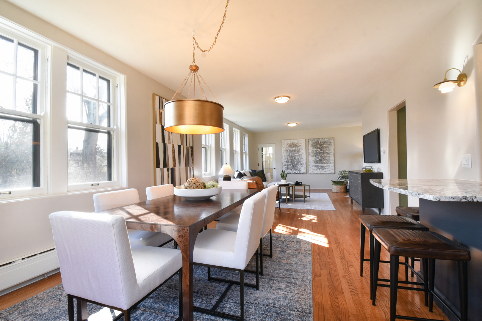 427 Uvedale Road Riverside, IL 60546 - Photo 7 of 33 a dining room with furniture a chandelier and wooden floor