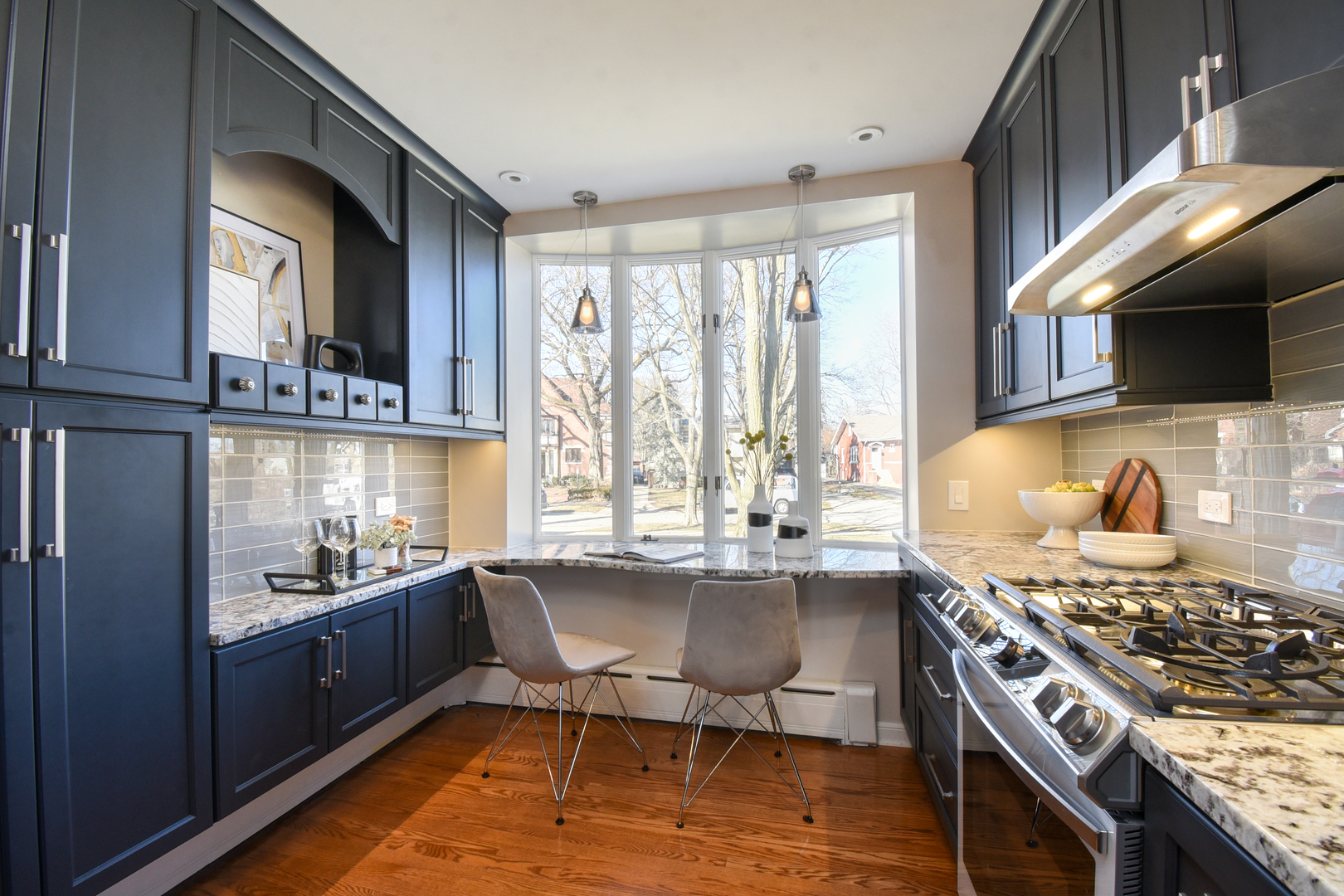 427 Uvedale Road Riverside, IL 60546 - Photo 10 of 33 a kitchen with a stove a sink and a microwave