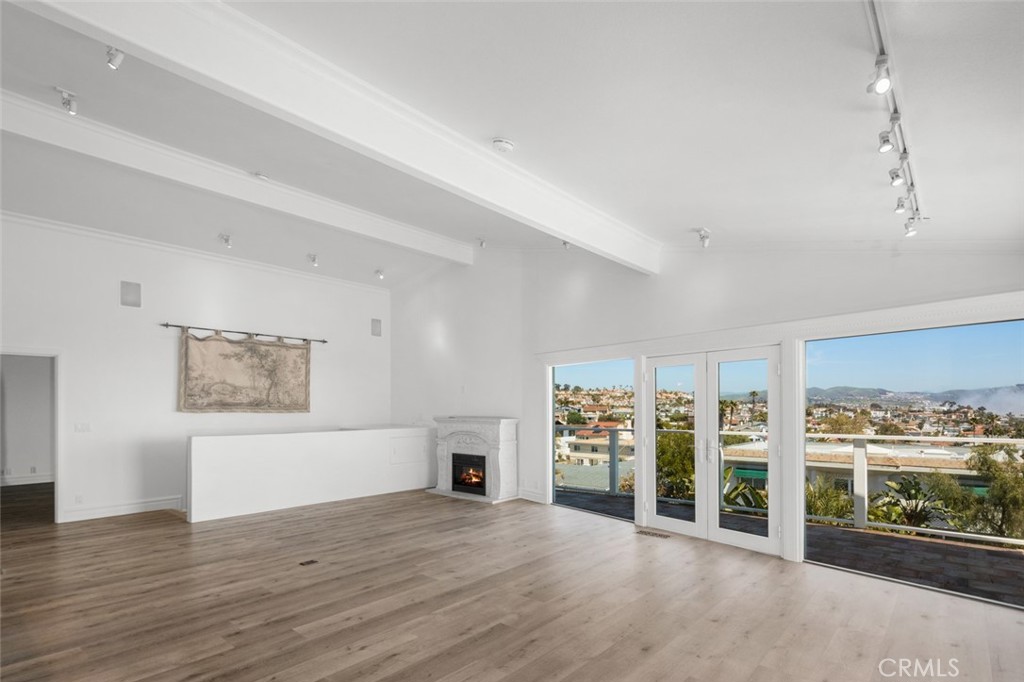 33941 Granada Drive Dana Point, CA 92629 - Photo 14 of 61 a view of an empty room with window and wooden floor