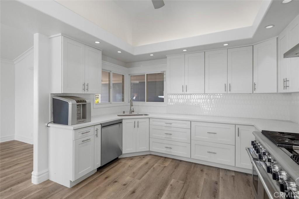 33941 Granada Drive Dana Point, CA 92629 - Photo 17 of 61 a kitchen with white cabinets stainless steel appliances and sink