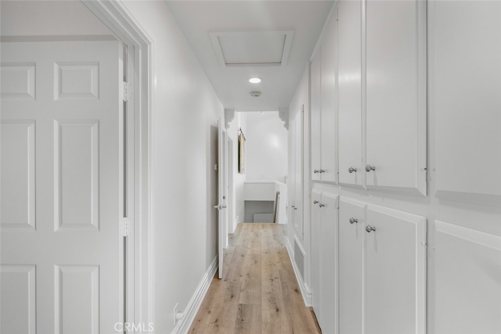 33941 Granada Drive Dana Point, CA 92629 - Photo 21 of 61 a view of a hallway with wooden floor