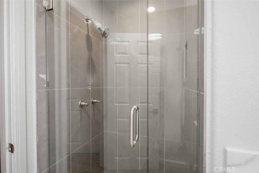 33941 Granada Drive Dana Point, CA 92629 - Photo 27 of 61 a bathroom with a shower and a glass door