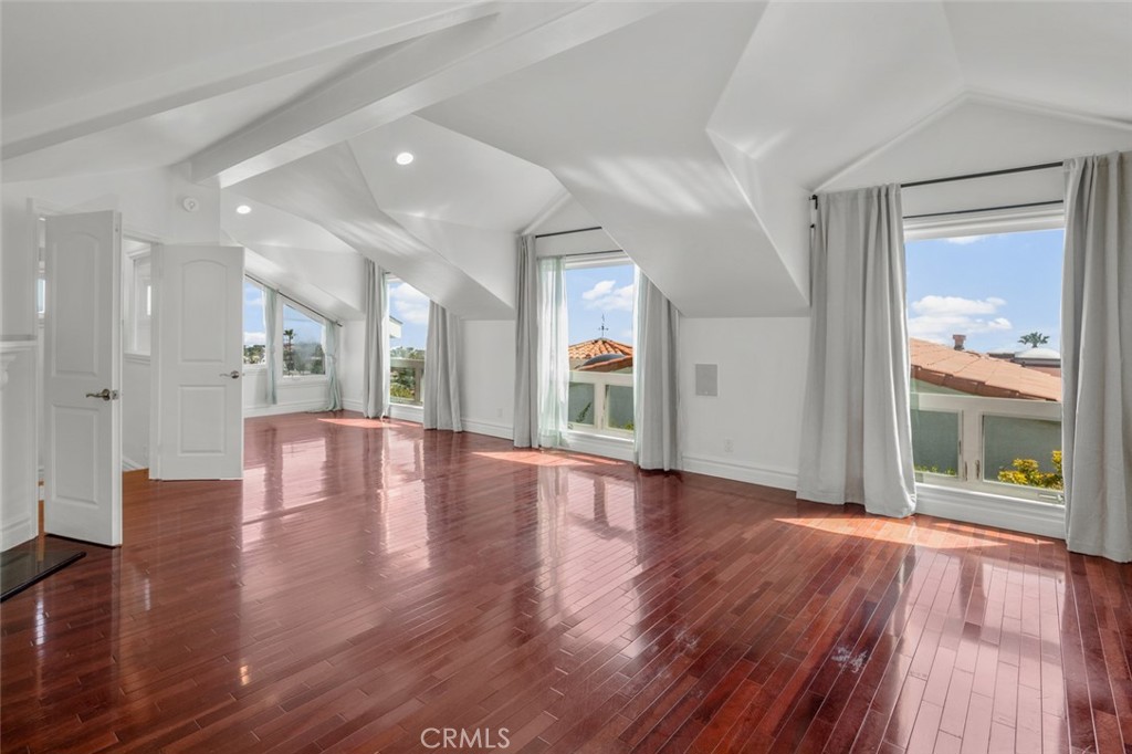 33941 Granada Drive Dana Point, CA 92629 - Photo 29 of 61 a view of an empty room with wooden floor and a window