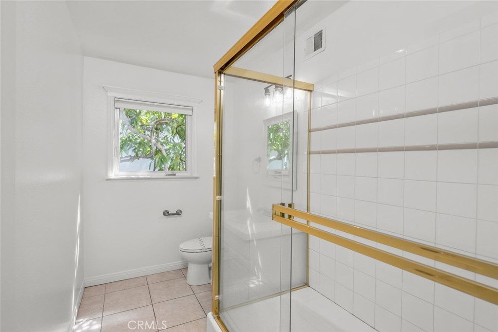 33941 Granada Drive Dana Point, CA 92629 - Photo 47 of 61 a bathroom with a shower and a toilet