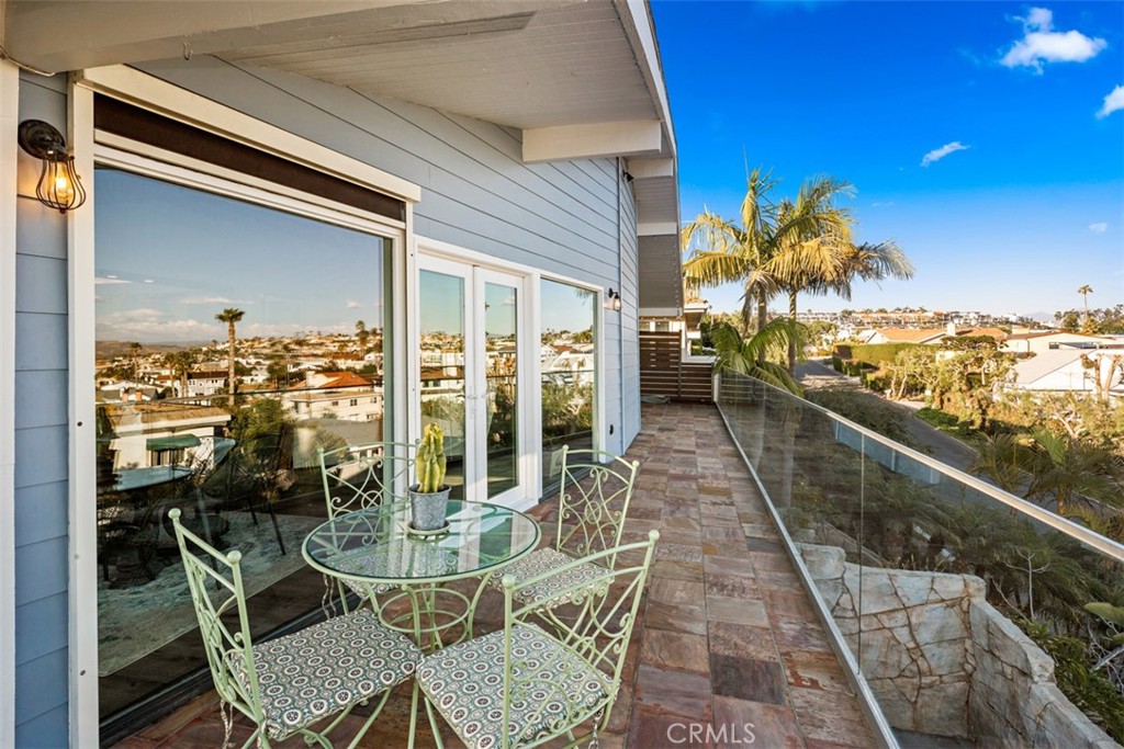 33941 Granada Drive Dana Point, CA 92629 - Photo 56 of 61 a view of a balcony dining table and chairs