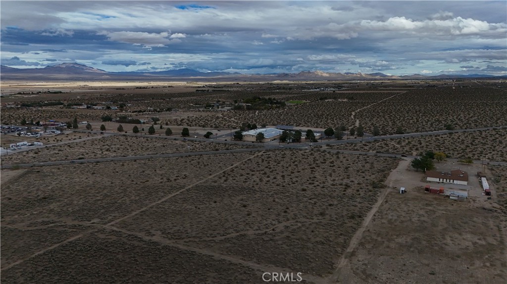 785 Furst Street Lucerne Valley, CA 92356 - Photo 4 of 11 a view of a dry yard with wooden floor and city view