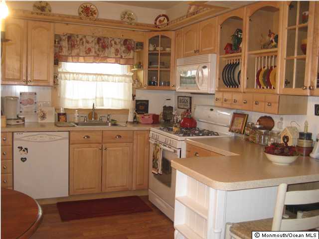 92 Jordan Road Brick, NJ 08724 - Photo 3 of 3 a kitchen with a sink cabinets and window