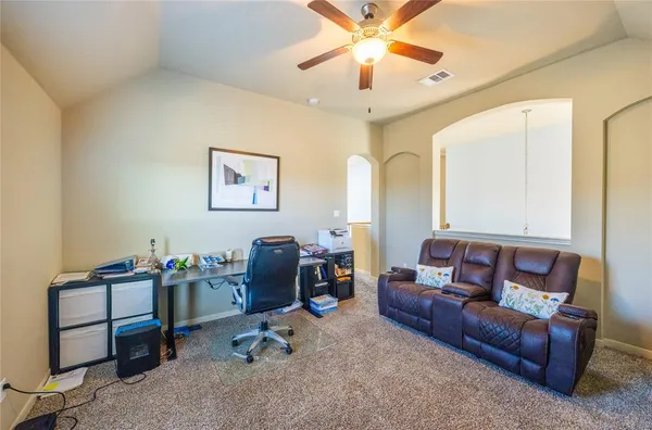 a living room with furniture and a couch