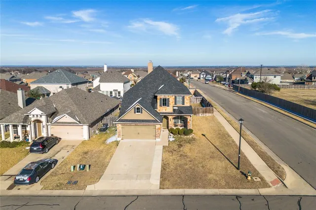 an aerial view of a house with a ocean view