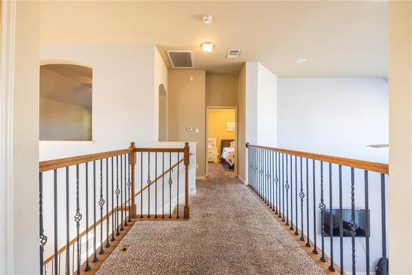 a kitchen with stainless steel appliances granite countertop lots of counter top space a sink and a wooden floors