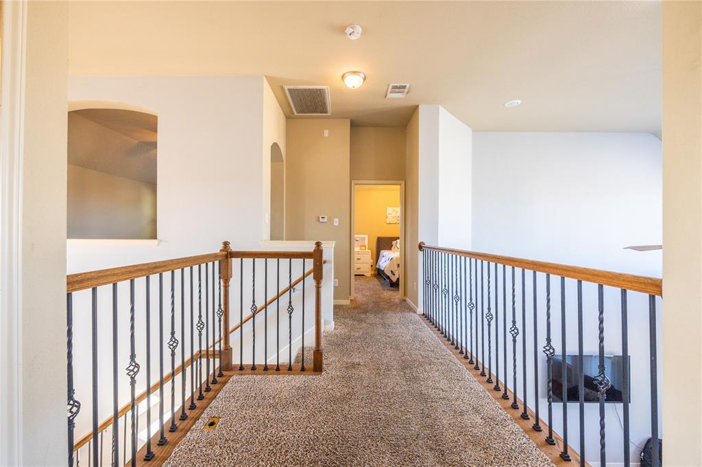 10864 Aurora Drive Waco, TX 76708 - Photo 21 of 40 a view of a hallway with a large window and stairs