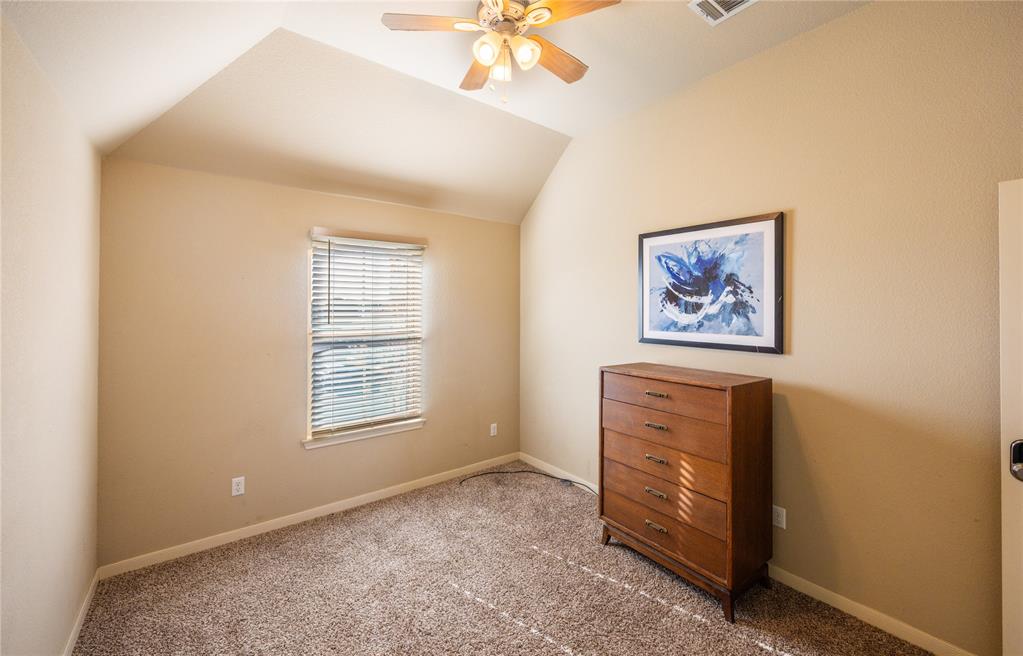 10864 Aurora Drive Waco, TX 76708 - Photo 23 of 40 an empty room with windows and fan