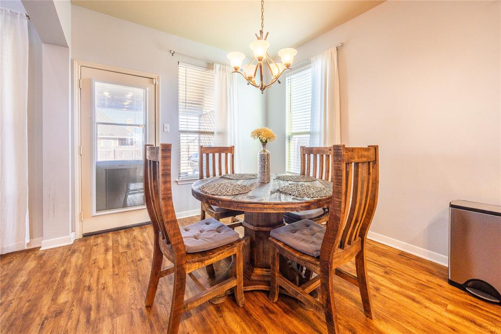 10864 Aurora Drive Waco, TX 76708 - Photo 24 of 40 a view of a dining room with furniture window and wooden floor