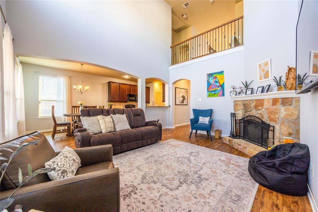 10864 Aurora Drive Waco, TX 76708 - Photo 25 of 40 a living room with furniture and a fireplace