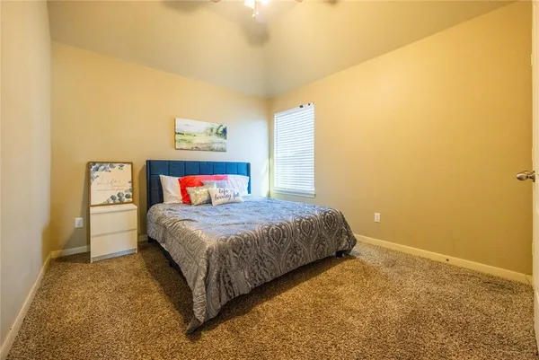 an aerial view of residential houses with outdoor space and ocean view