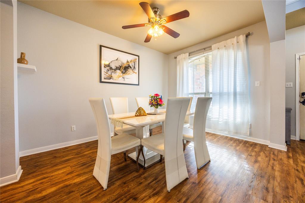 10864 Aurora Drive Waco, TX 76708 - Photo 34 of 40 a view of a dining room with furniture window and wooden floor