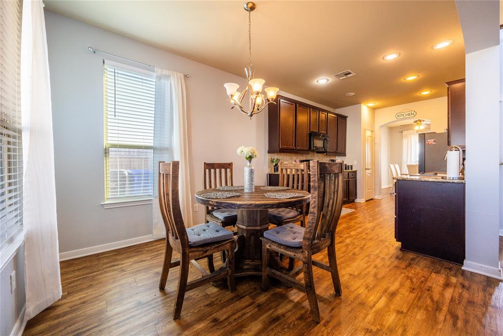 10864 Aurora Drive Waco, TX 76708 - Photo 37 of 40 a view of a dining room with furniture window and wooden floor