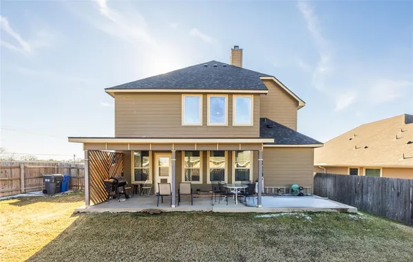 a front view of a house with outdoor seating yard