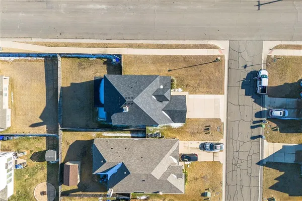 a view of a terrace with lawn chairs