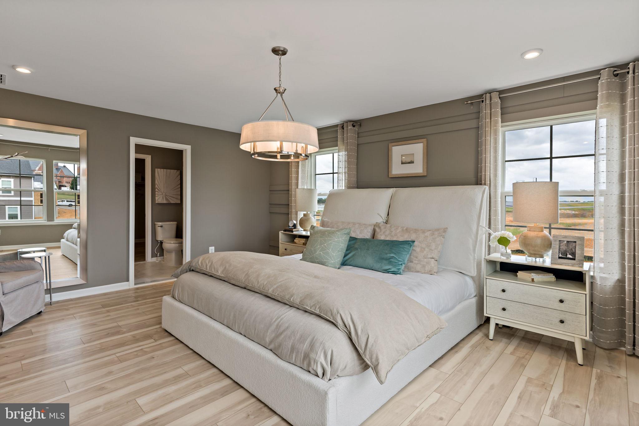 Tbb Heritage Drive, Unit WHITEHALL Hanover, PA 17331 - Photo 16 of 55 a bedroom with a large bed and a chandelier