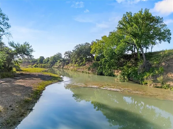 a view of a lake with houses in outdoor space