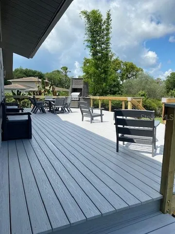 swimming pool view with a seating space