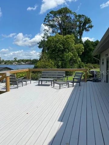 a sitting area with furniture and a yard