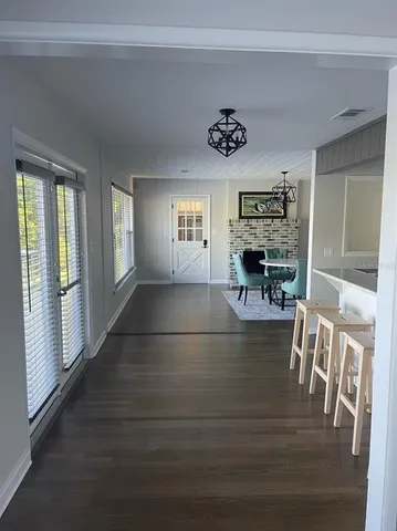 a view of living room with furniture and flat screen tv