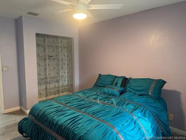 324 Southeast Bloxham Way Stuart, FL 34997 - Photo 11 of 35 a bedroom with a bed and a window