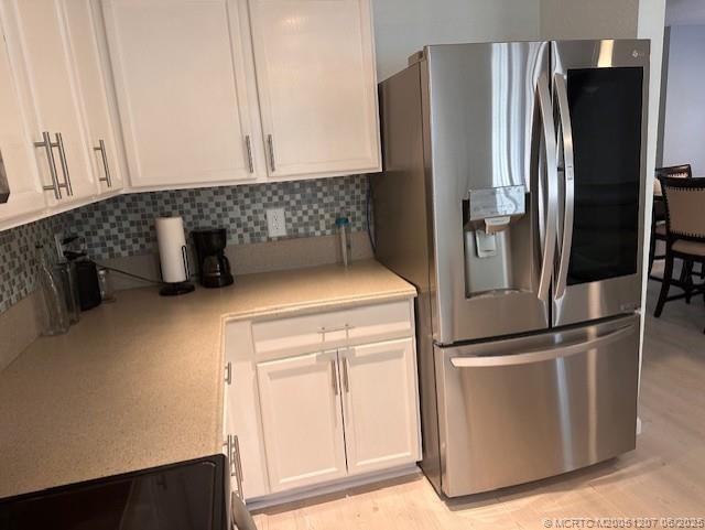 324 Southeast Bloxham Way Stuart, FL 34997 - Photo 15 of 35 a kitchen with metallic refrigerator freezer and a dishwasher