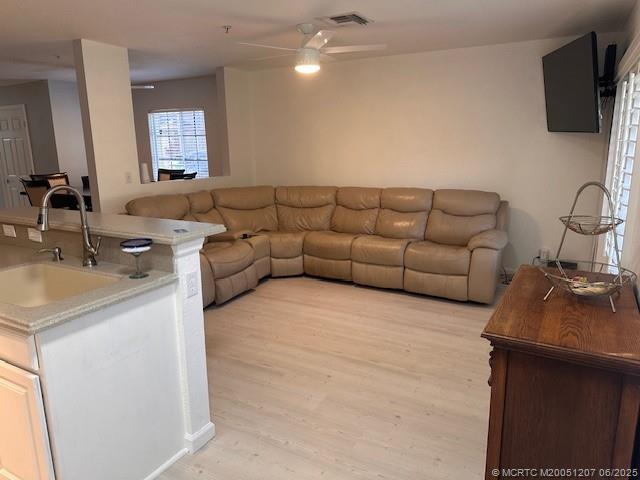 324 Southeast Bloxham Way Stuart, FL 34997 - Photo 16 of 35 a living room with furniture and a flat screen tv