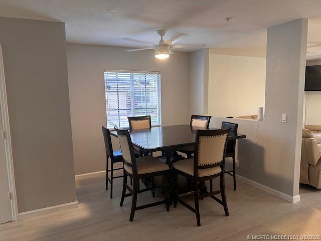 324 Southeast Bloxham Way Stuart, FL 34997 - Photo 18 of 35 a view of a dining room with furniture and window
