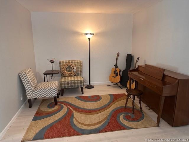 324 Southeast Bloxham Way Stuart, FL 34997 - Photo 19 of 35 a living room with furniture and a wooden floor