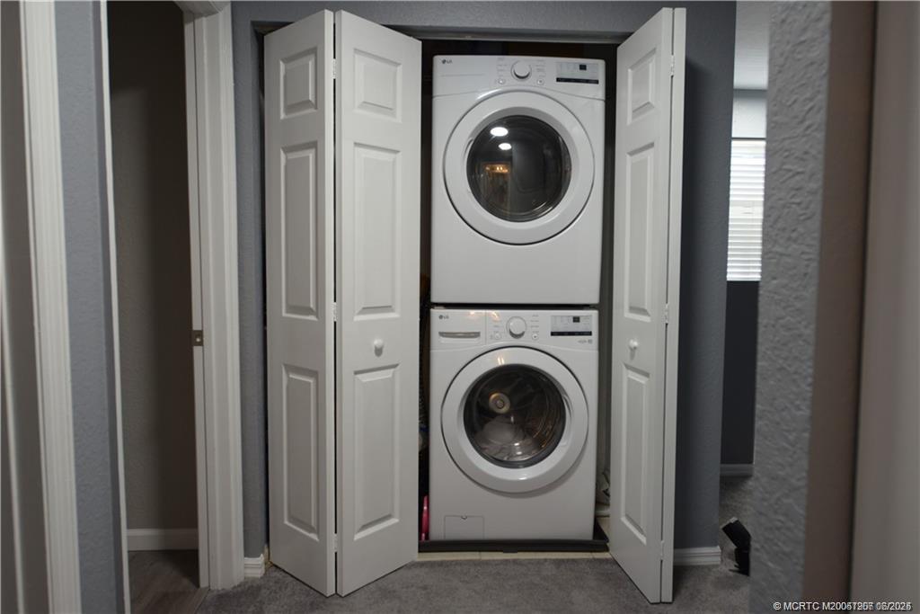 324 Southeast Bloxham Way Stuart, FL 34997 - Photo 23 of 35 a view of a hallway with washer and dryer