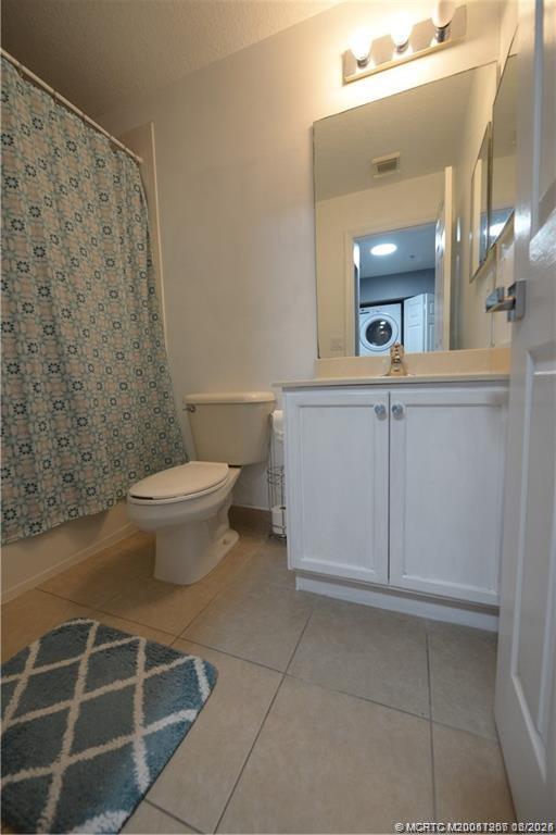 324 Southeast Bloxham Way Stuart, FL 34997 - Photo 24 of 35 a bathroom with a toilet sink and mirror