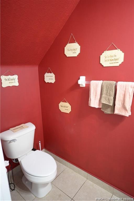 324 Southeast Bloxham Way Stuart, FL 34997 - Photo 29 of 35 a bathroom with a toilet sink and mirror