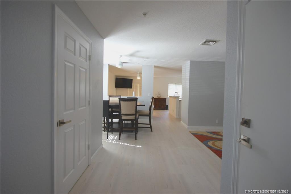 324 Southeast Bloxham Way Stuart, FL 34997 - Photo 34 of 35 a view of a hallway with seating area