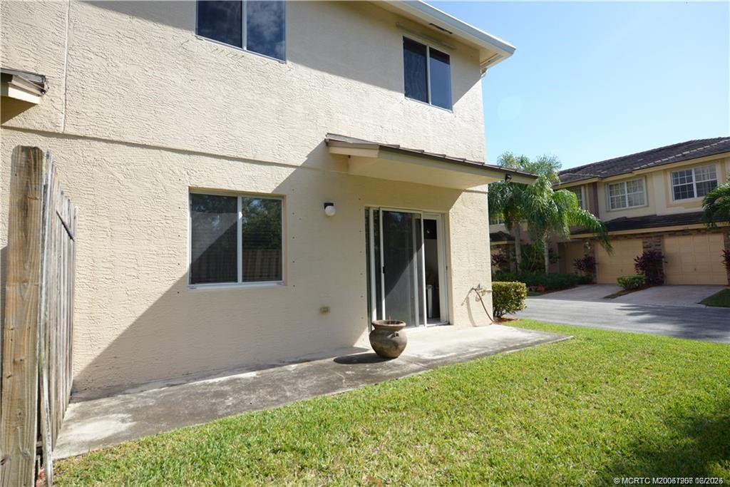 324 Southeast Bloxham Way Stuart, FL 34997 - Photo 4 of 35 a view of a house with a yard
