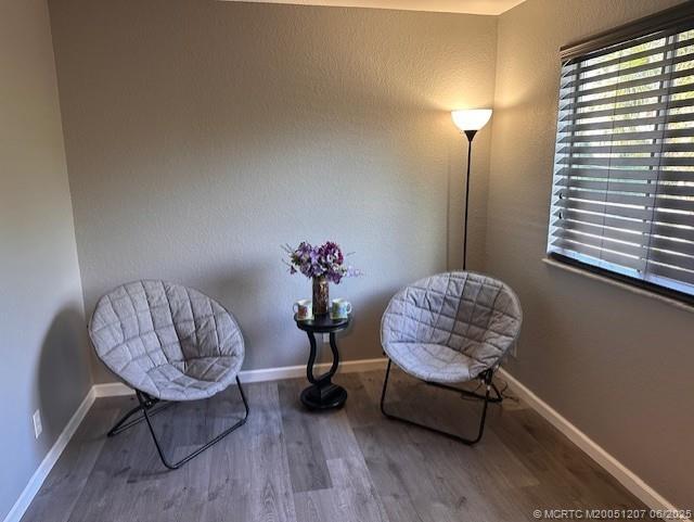 324 Southeast Bloxham Way Stuart, FL 34997 - Photo 7 of 35 a living room with furniture and a chair