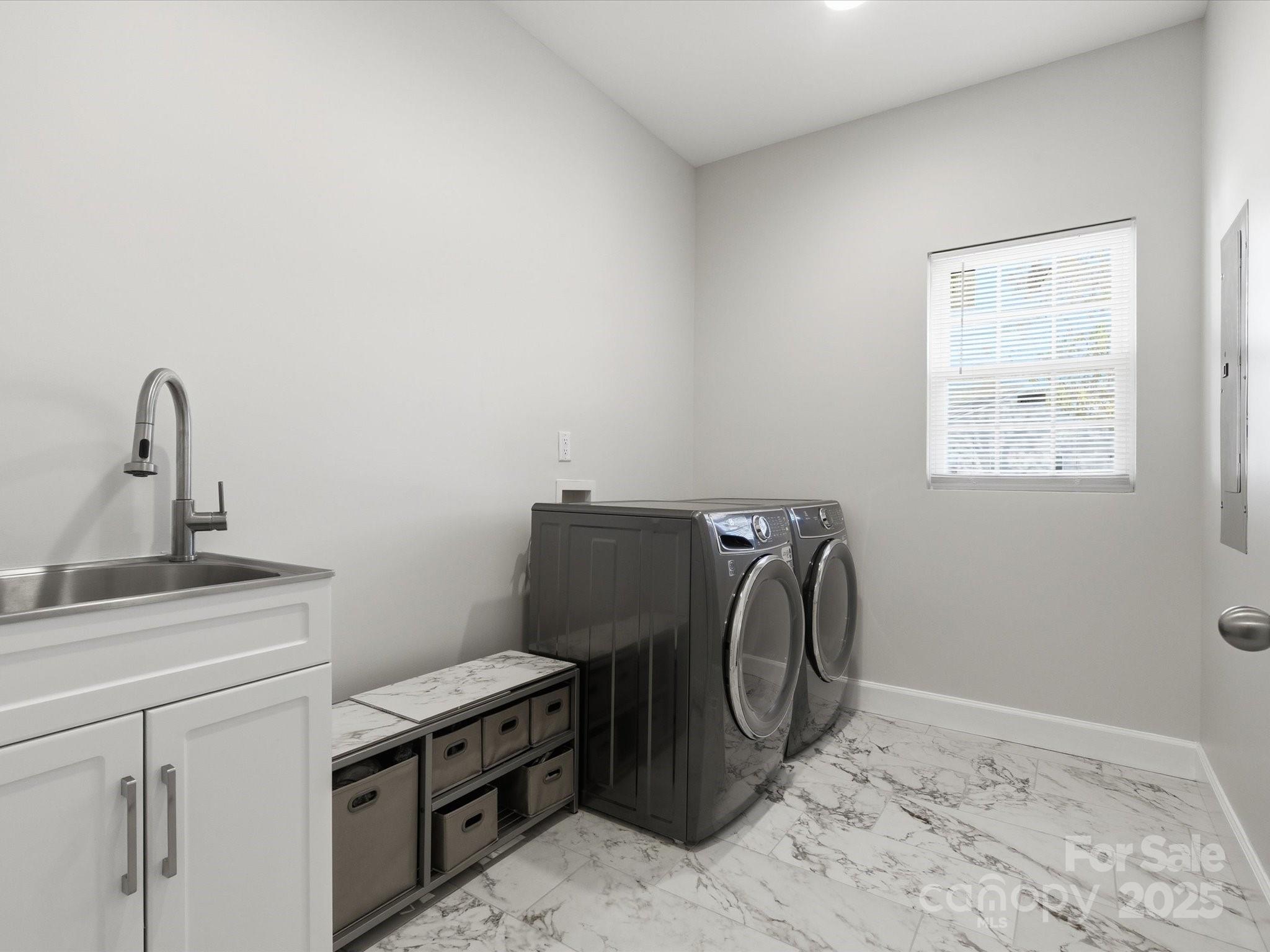 3211 Oakdale Road Charlotte, NC 28216 - Photo 18 of 43 a view of a storage and utility room with a sink