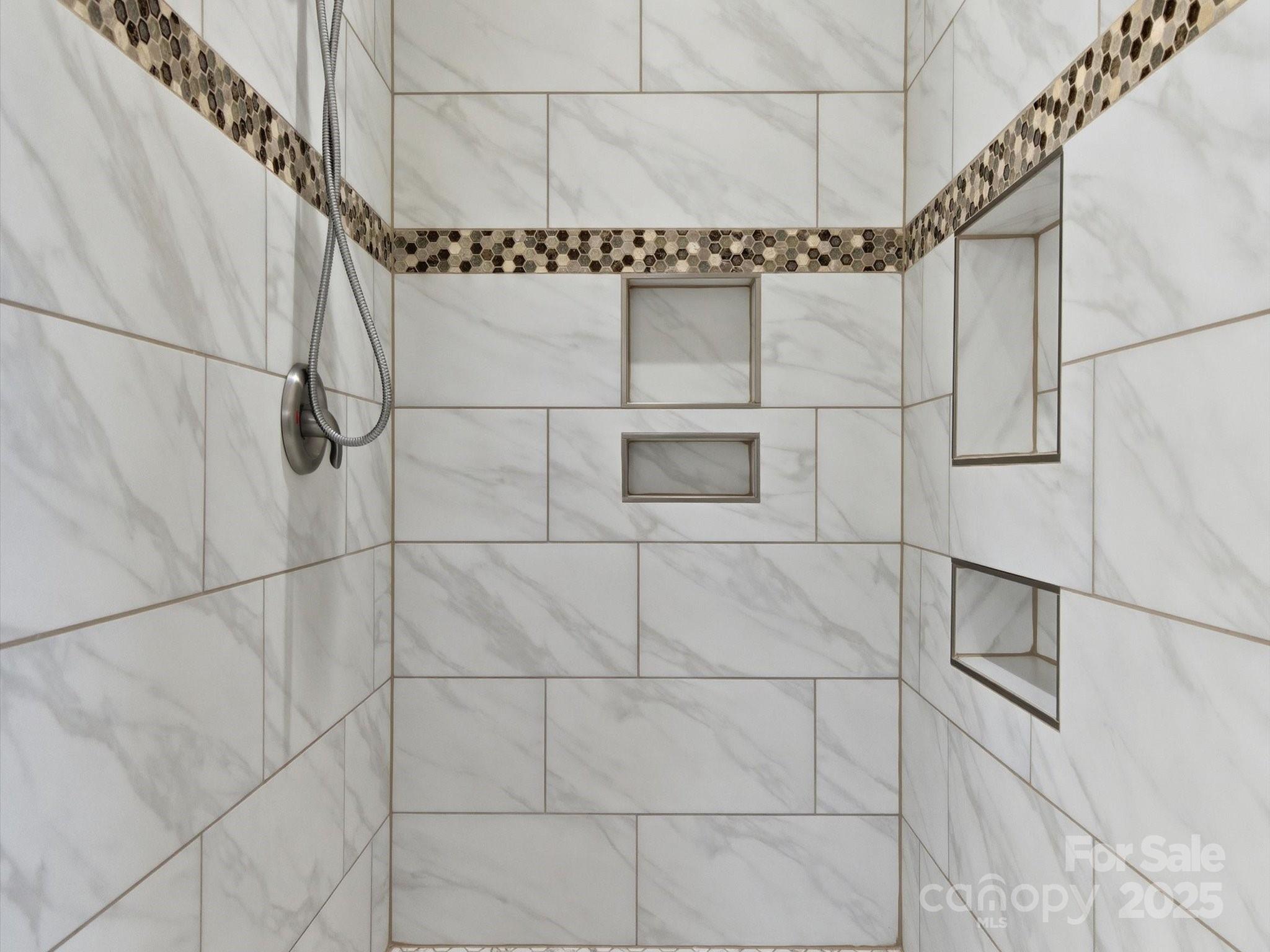 3211 Oakdale Road Charlotte, NC 28216 - Photo 27 of 43 a bathroom with a window and a shower