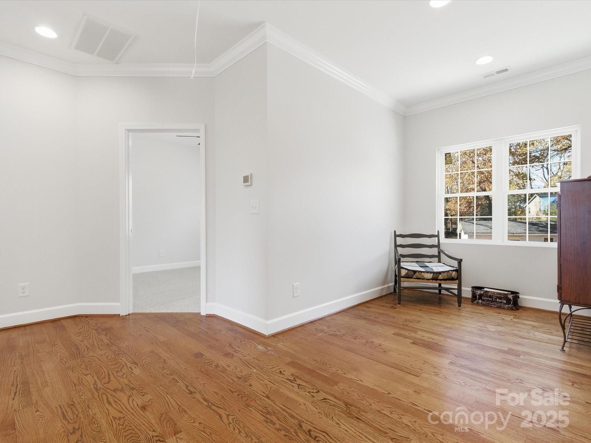 3211 Oakdale Road Charlotte, NC 28216 - Photo 29 of 43 a view of room with window and wooden floor