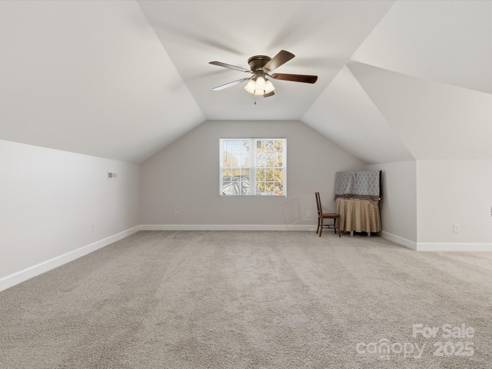 3211 Oakdale Road Charlotte, NC 28216 - Photo 30 of 43 an empty room with windows and fan