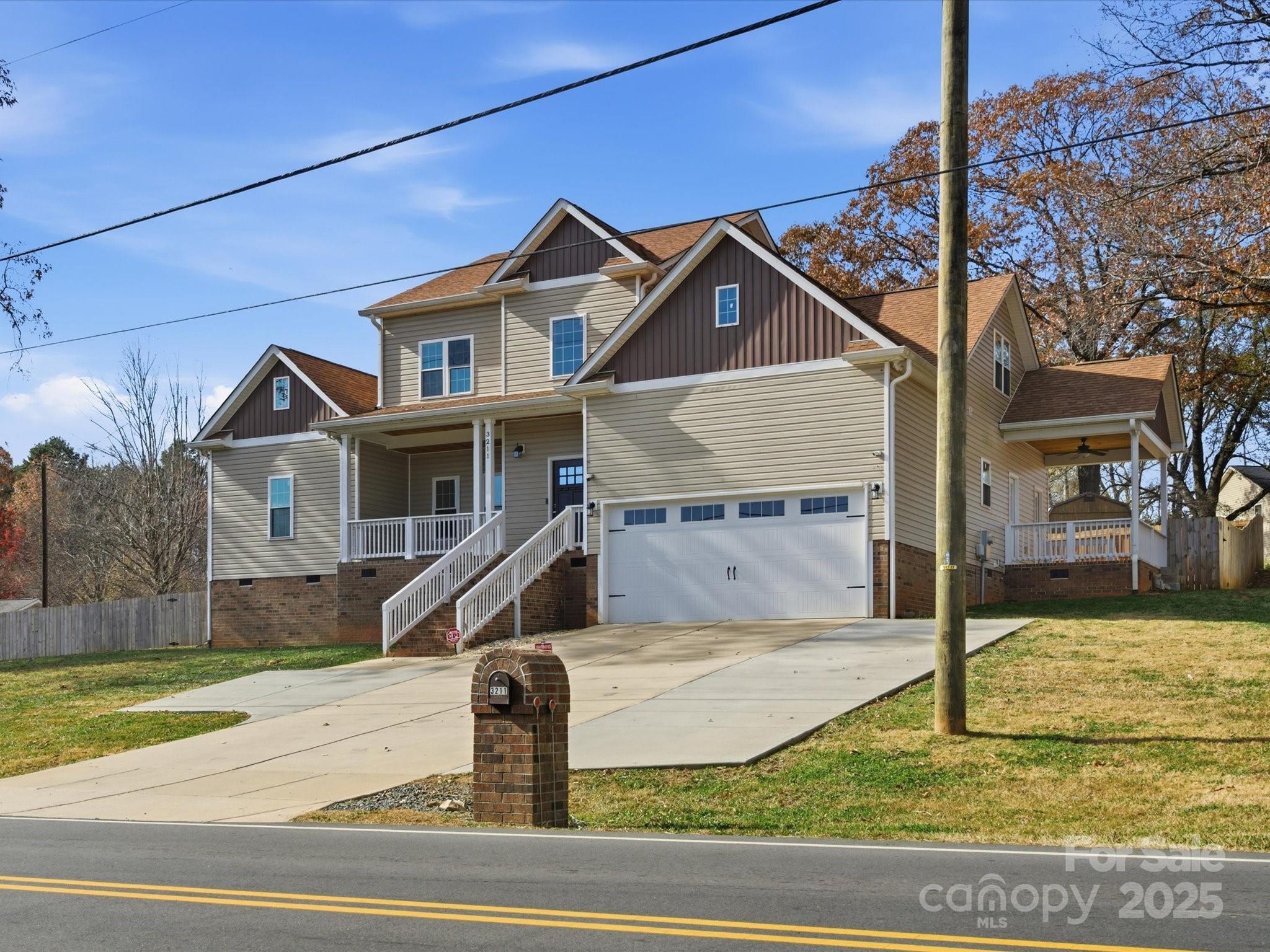3211 Oakdale Road Charlotte, NC 28216 - Photo 3 of 43 a front view of a house with a yard