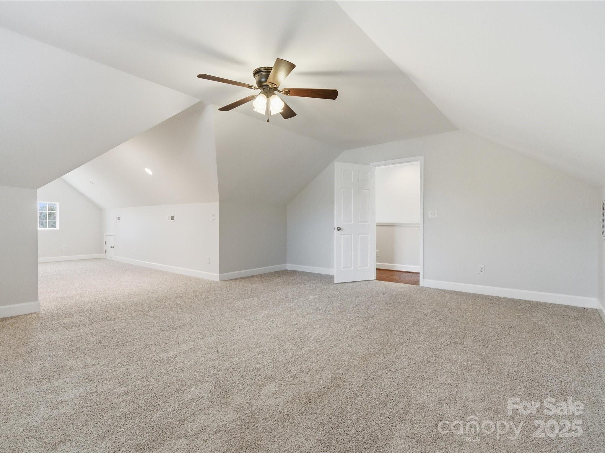 3211 Oakdale Road Charlotte, NC 28216 - Photo 32 of 43 a view of an empty room with a fan