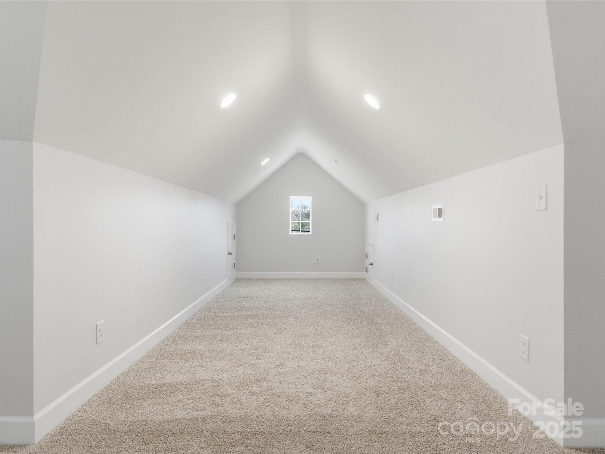 3211 Oakdale Road Charlotte, NC 28216 - Photo 33 of 43 an empty room with a window and a ceiling fan