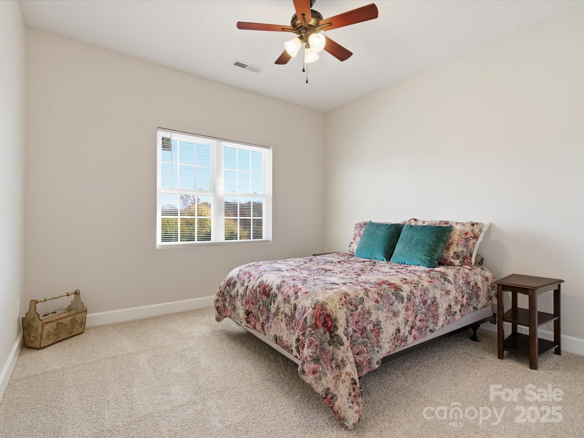 3211 Oakdale Road Charlotte, NC 28216 - Photo 36 of 43 a bedroom with a bed and window